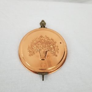 Vintage copper and brass key holder with embossed flower bouquet.